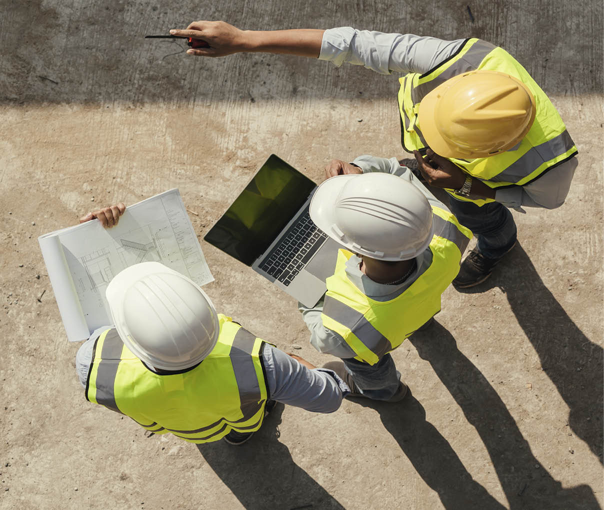 Top view, Team engineer building inspection use tablet computer and blueprint working at construction site. Civil Engineer, Contractor and Architect discussing in construction site.