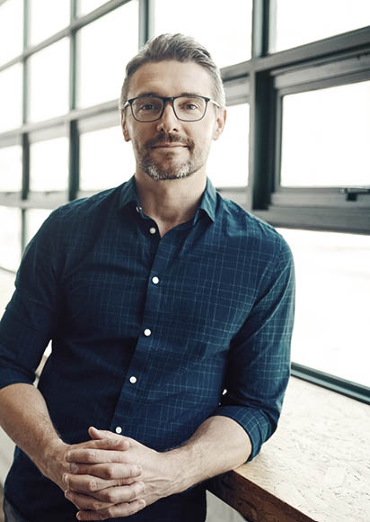 Portrait of a confident mature businessman working in a modern office
